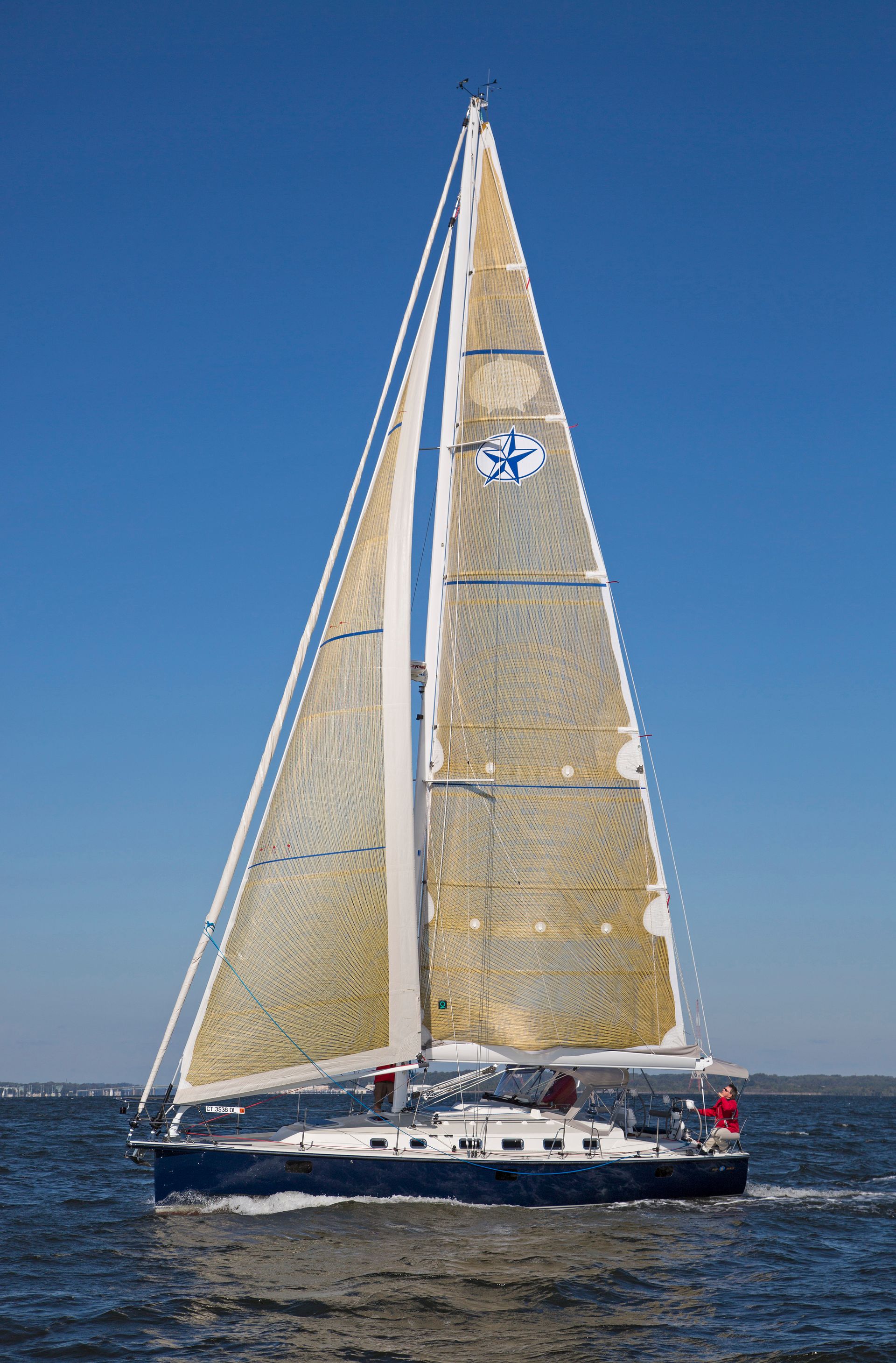 A drawing of a red sailboat on a white background.