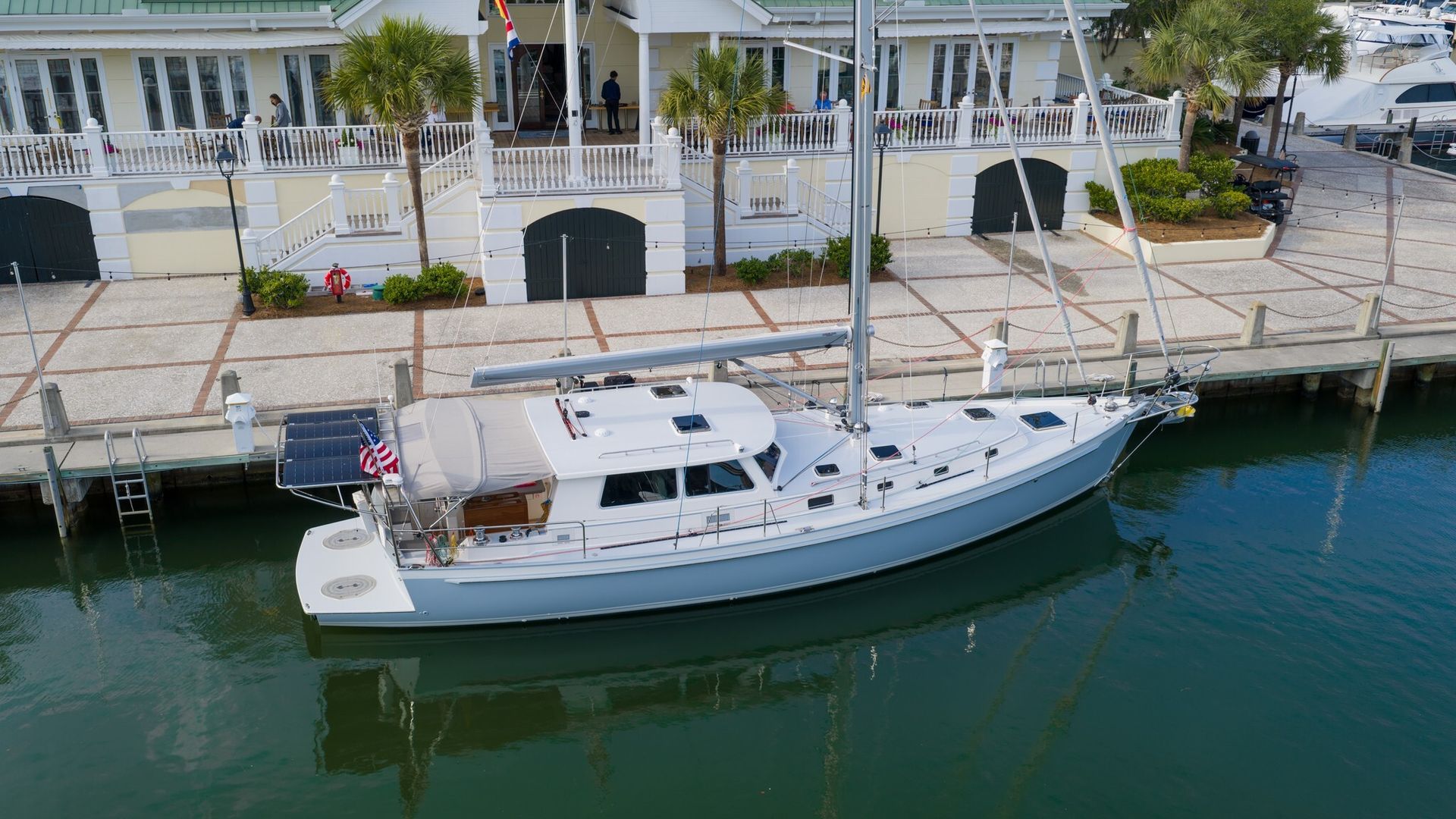 A sailboat is floating on top of a body of water.