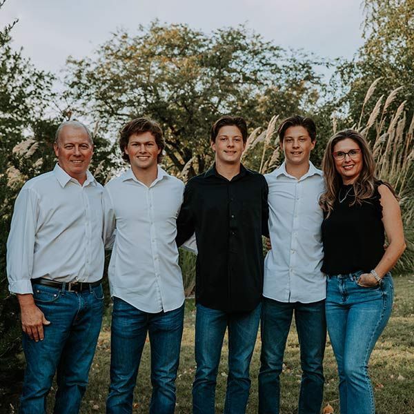 picture of Stephanie Carlin, owner, and her family