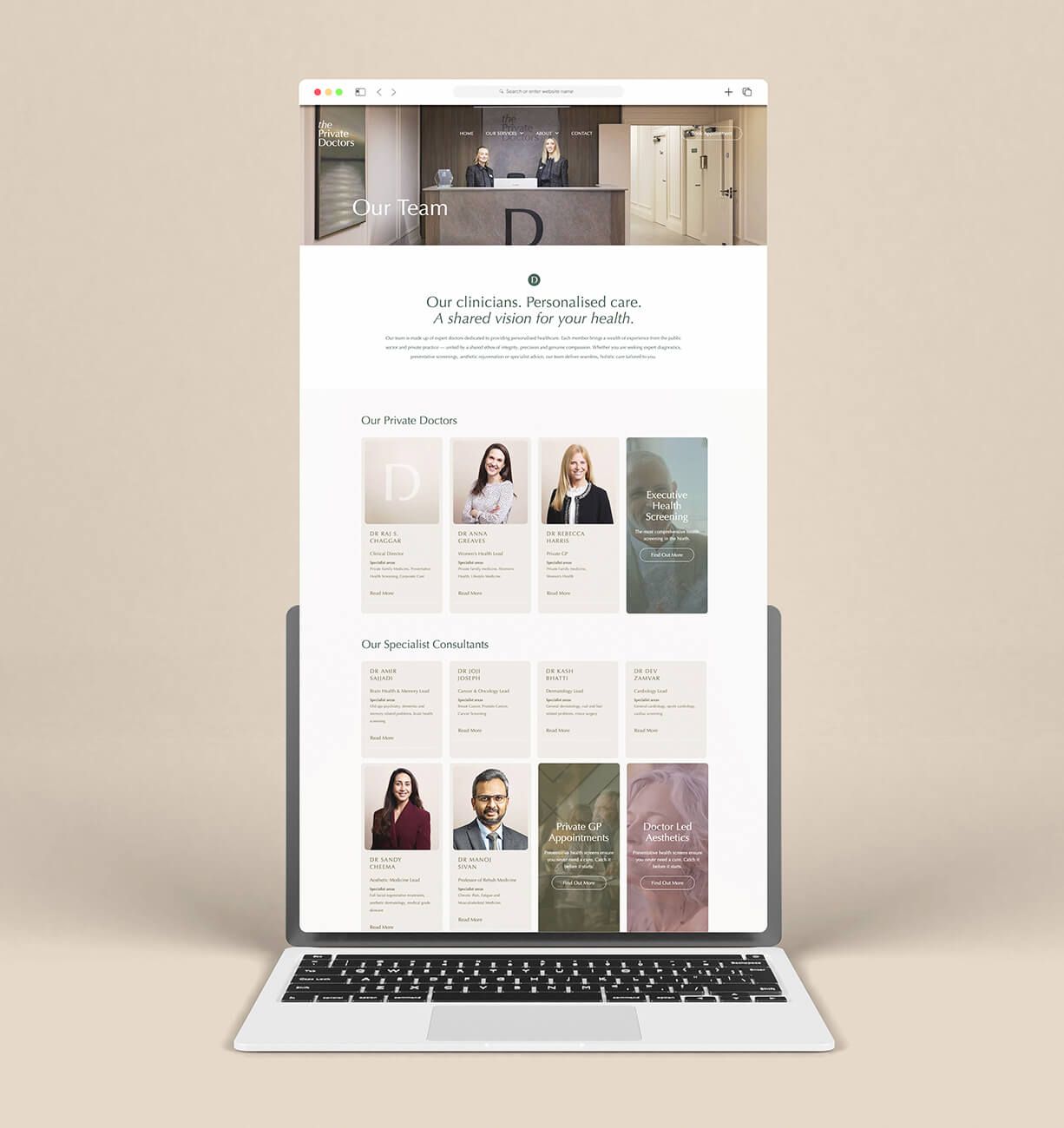 Laptop displaying a minimalist website with fashion photos on a beige background