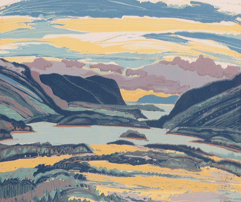 Blue lake framed by green hills,