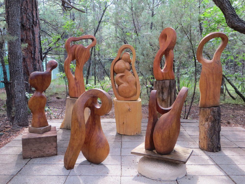 Wooden sculptures in a park setting