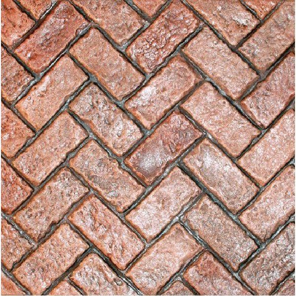 A close-up view of weathered, reddish-brown bricks laid in a classic herringbone pattern with grey mortar joints.
