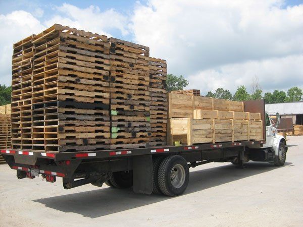 Pallets And Crates On Truck — Houston, TX — Cougar Pallet Inc