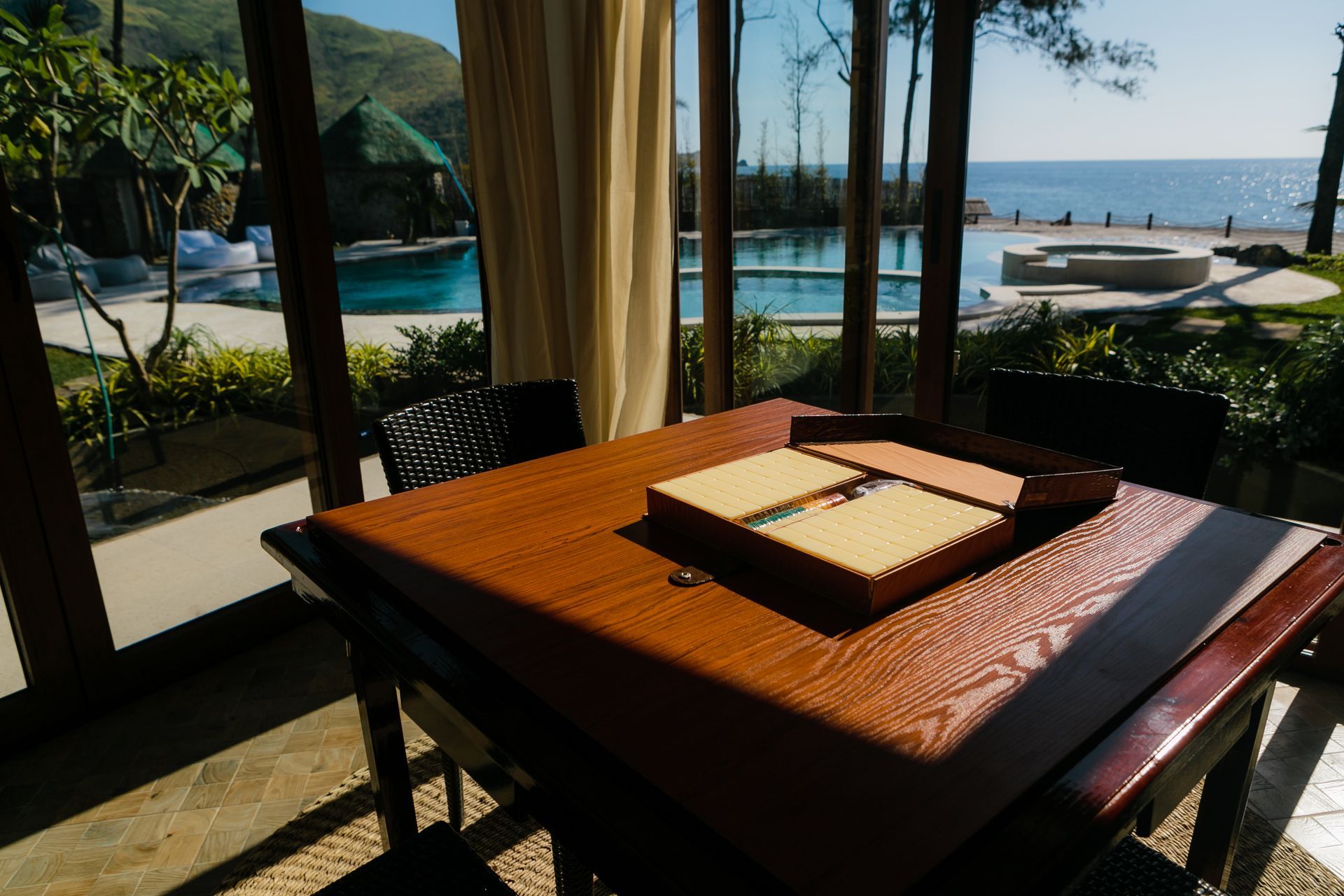 A dining room table with a domino board on it
