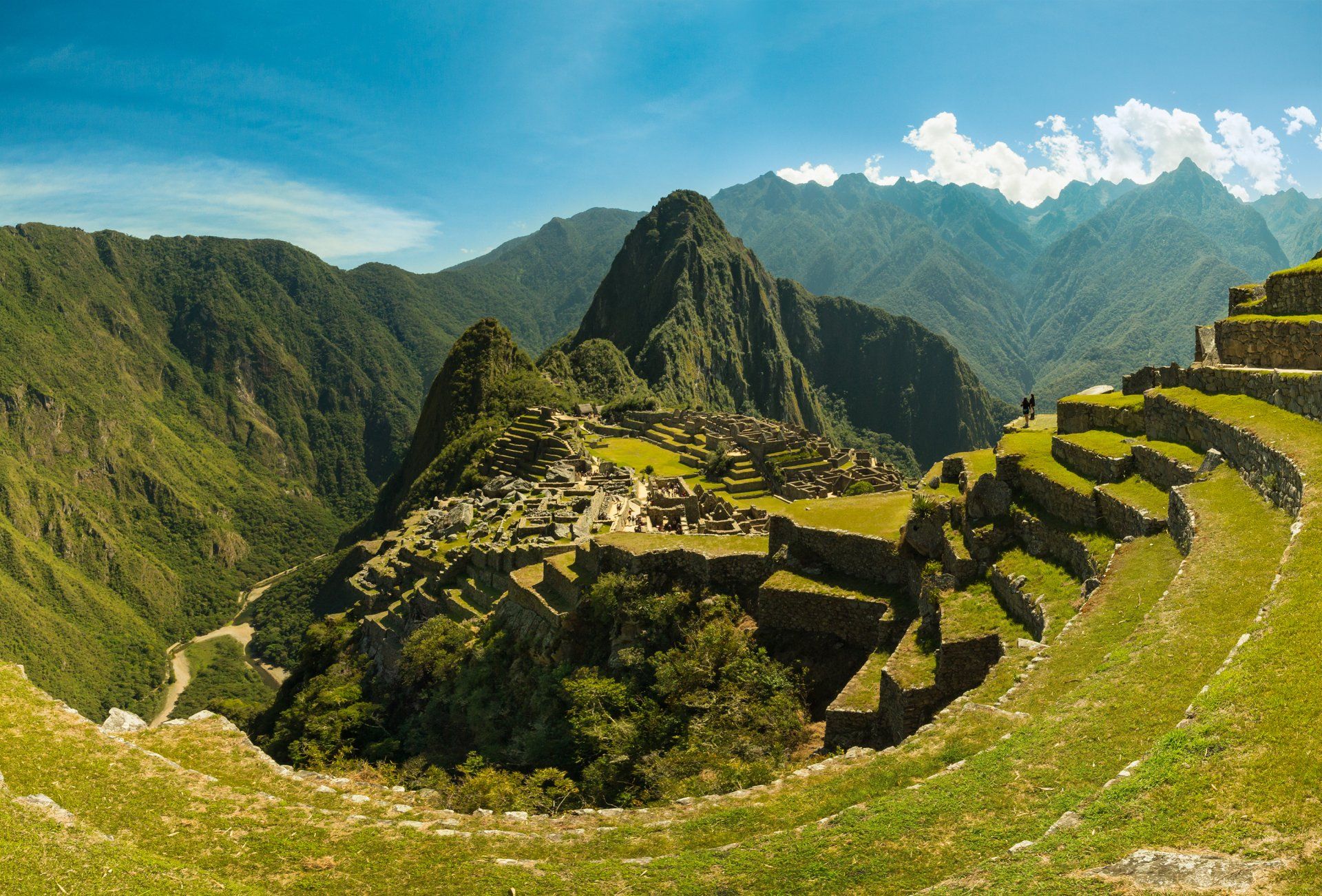 The ruins of the inca city of machu picchu are surrounded by mountains.