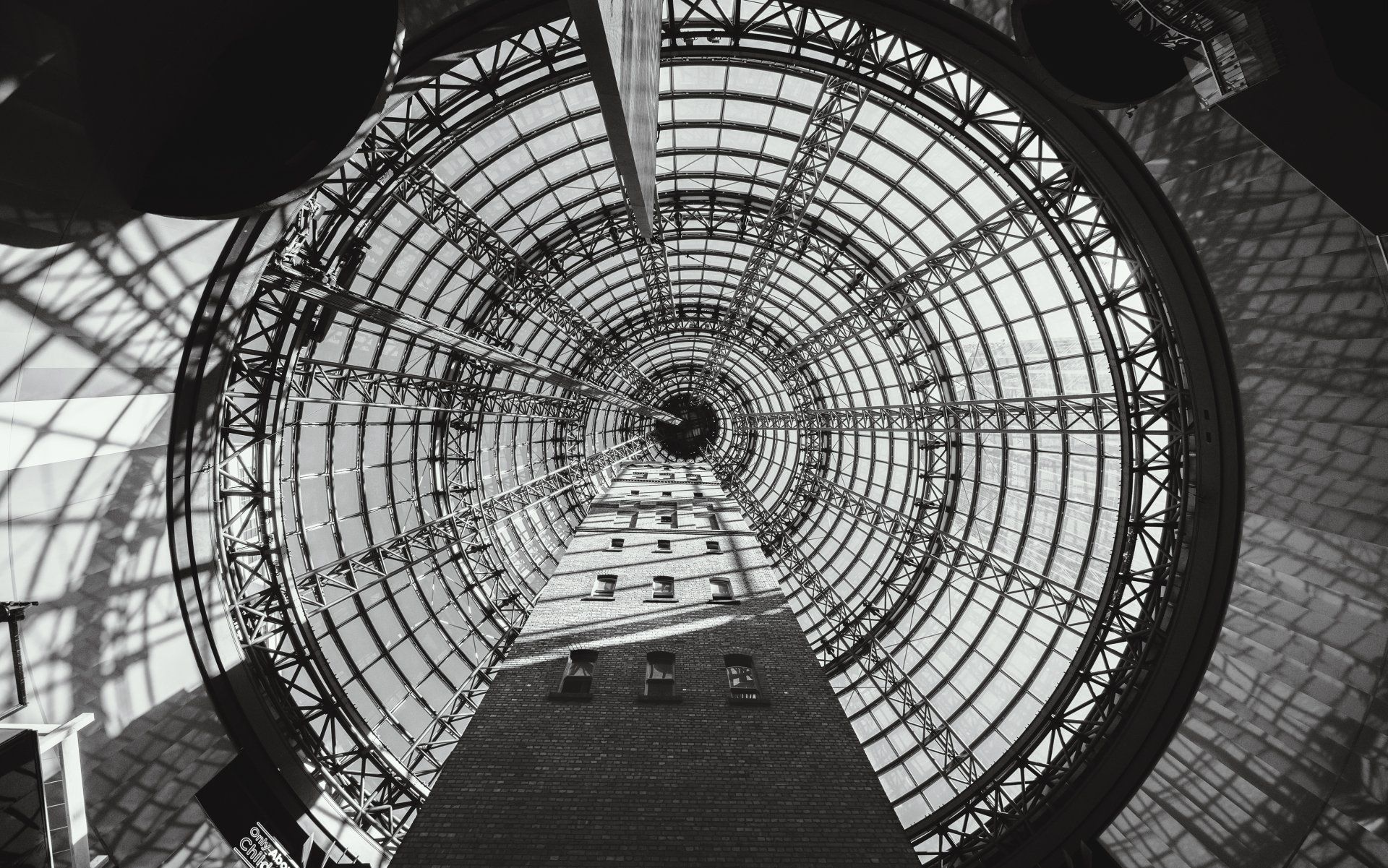 A black and white photo of a circular building