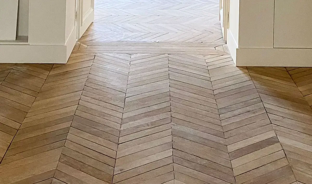 Chevron pattern wood floor.