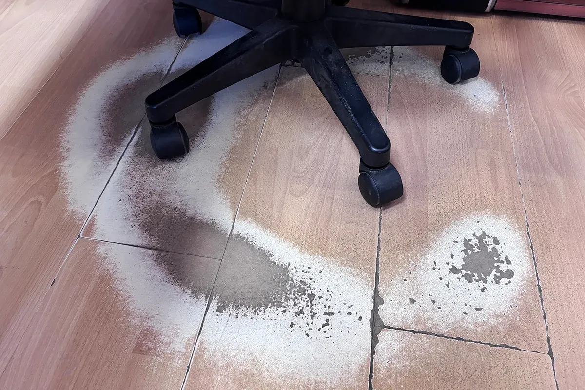 Damaged peel and stick flooring.