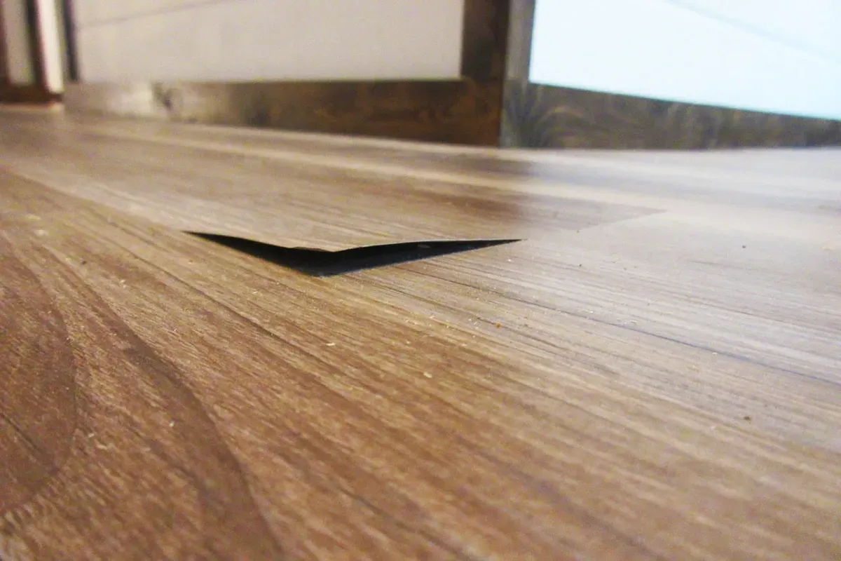 Delaminated engineered hardwood flooring.