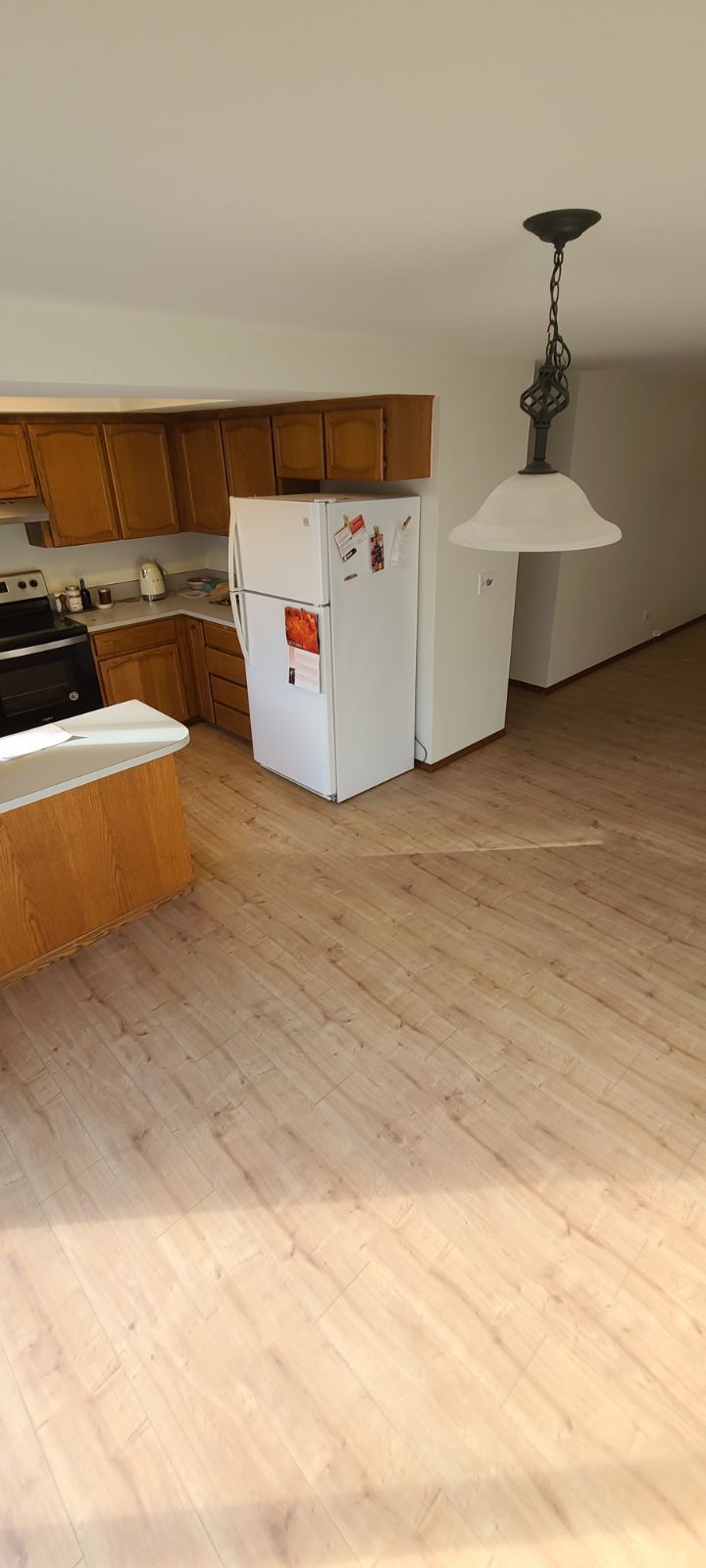 Kitchen after Orca laminate flooring installation.