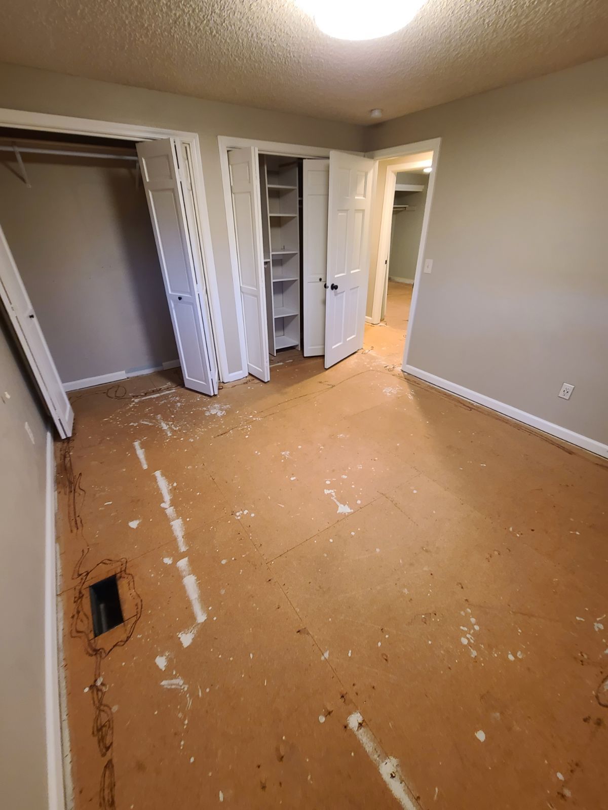 Bedroom before PacMat Flooring installation.