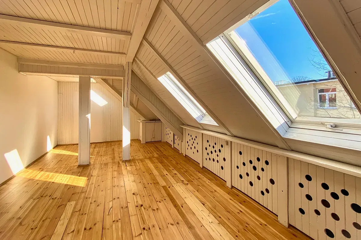 Pine flooring in an empty rooftop apartment.