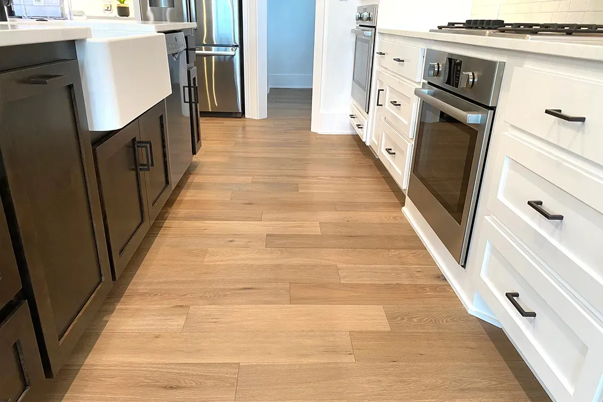 Staggered vinyl plank flooring in a kitchen.