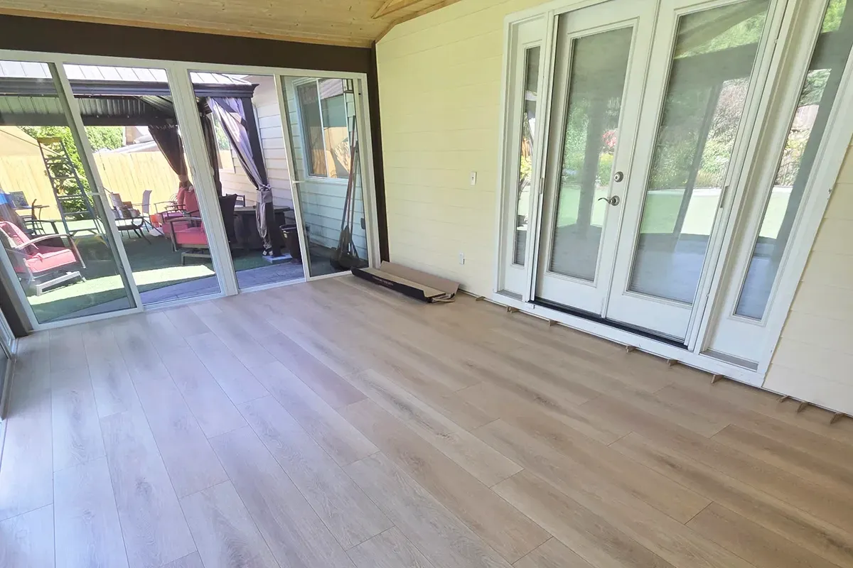 Sunroom flooring added onto the back of a Southwest Portland home by Rejuvenation Floor & Design.