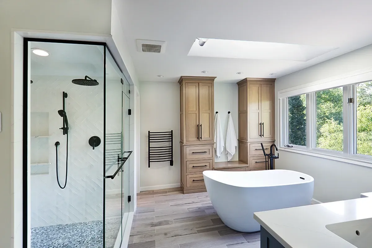 Vinyl flooring installation over tile in a bathroom.