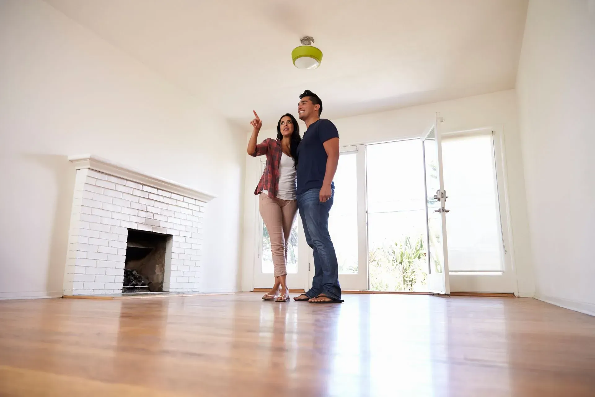 Young couple viewing a home for sale.