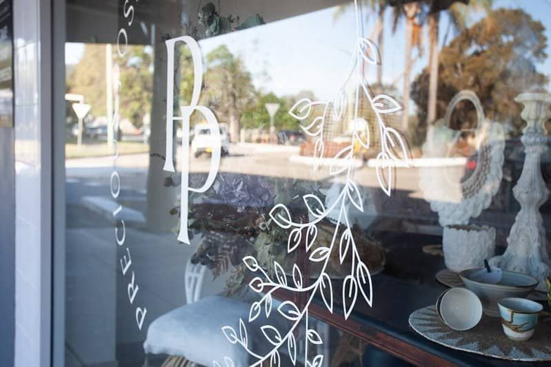 A Window With A Drawing Of A Tree On It  — Solis Signs in Toukley, NSW