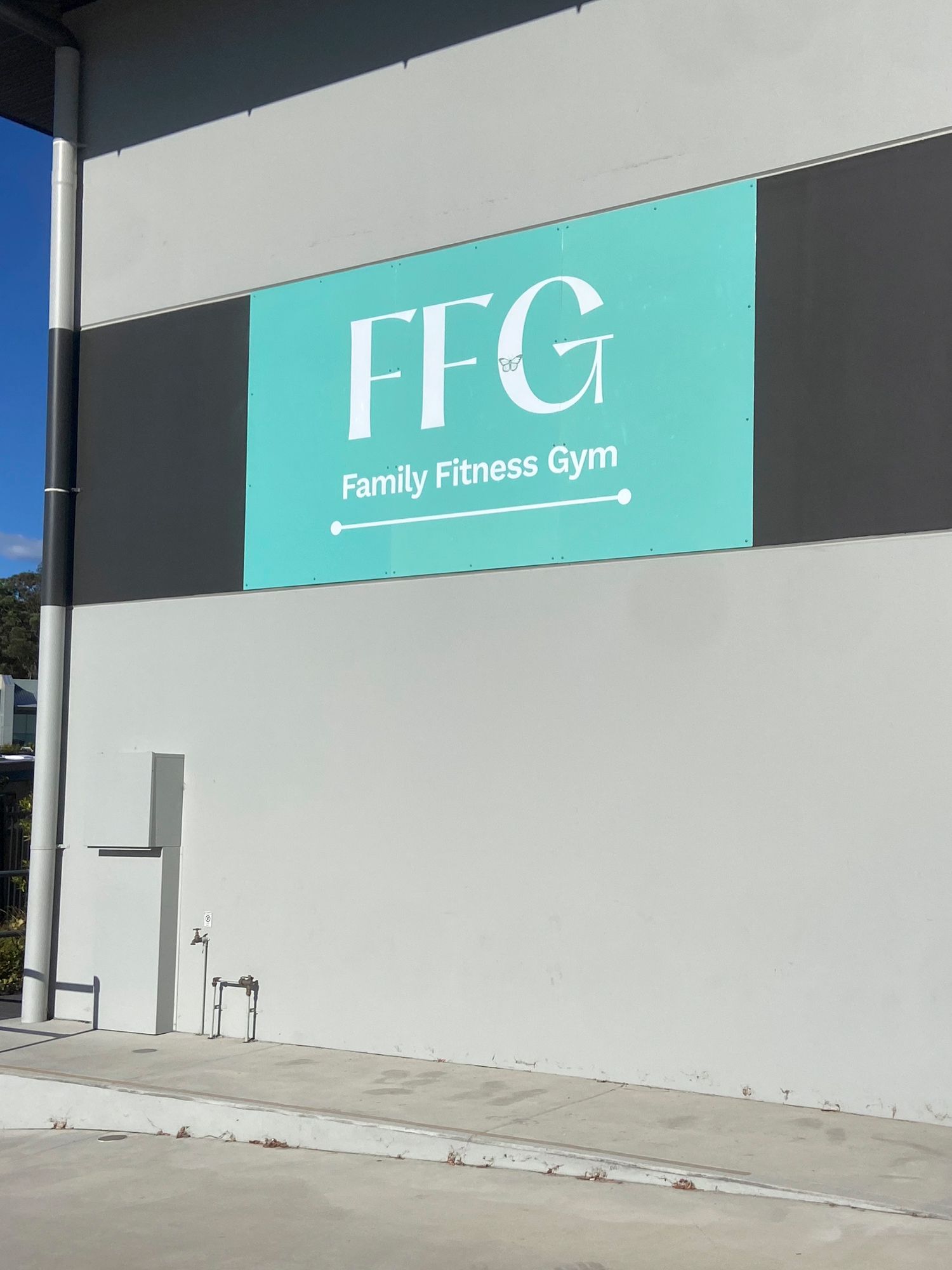 A sign on the side of a building that says ffg family fitness gym— Solis Signs in Toukley, NSW