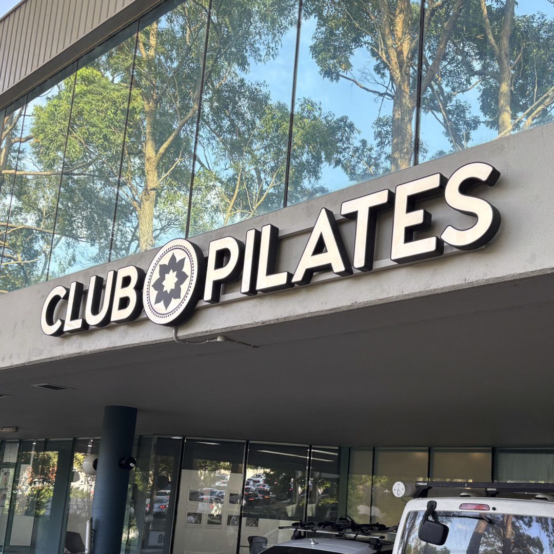 A Store Front With A Sign That Says Club Pilates  — Solis Signs in Toukley, NSW