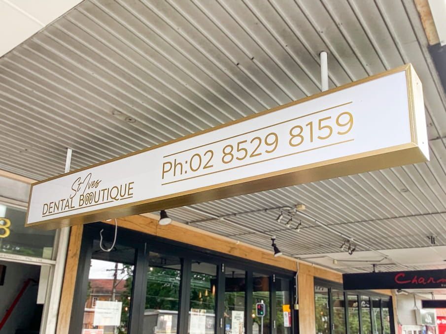The Front Door Of A Building With A sign  — Solis Signs in Toukley, NSW