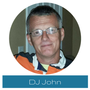 Portrait of DJ John wearing glasses and an orange hoodie, with his name shown below