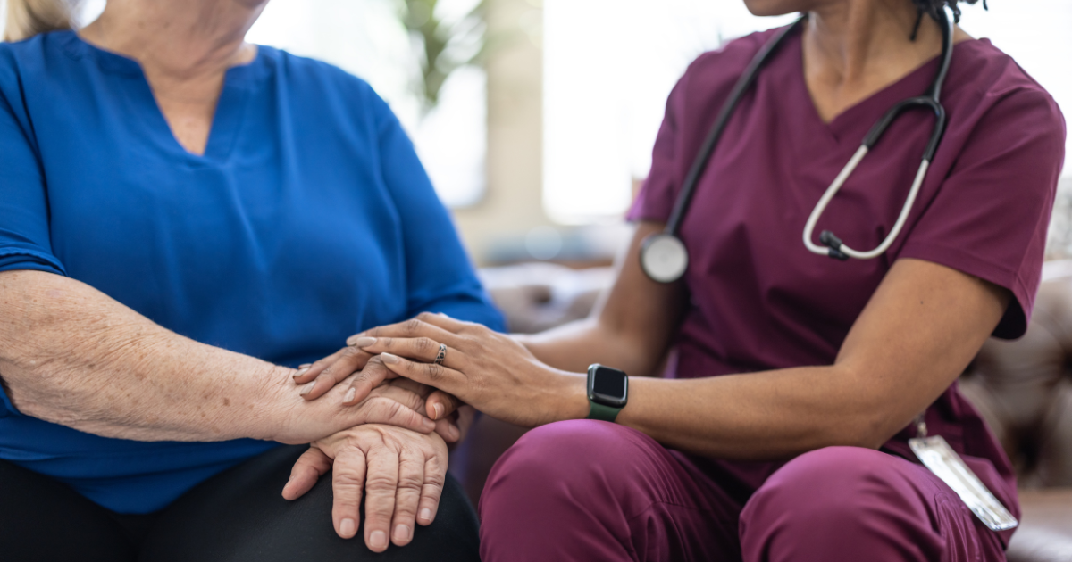 A healthcare professional comforting a patient, symbolizing compassionate medical care and patient support.