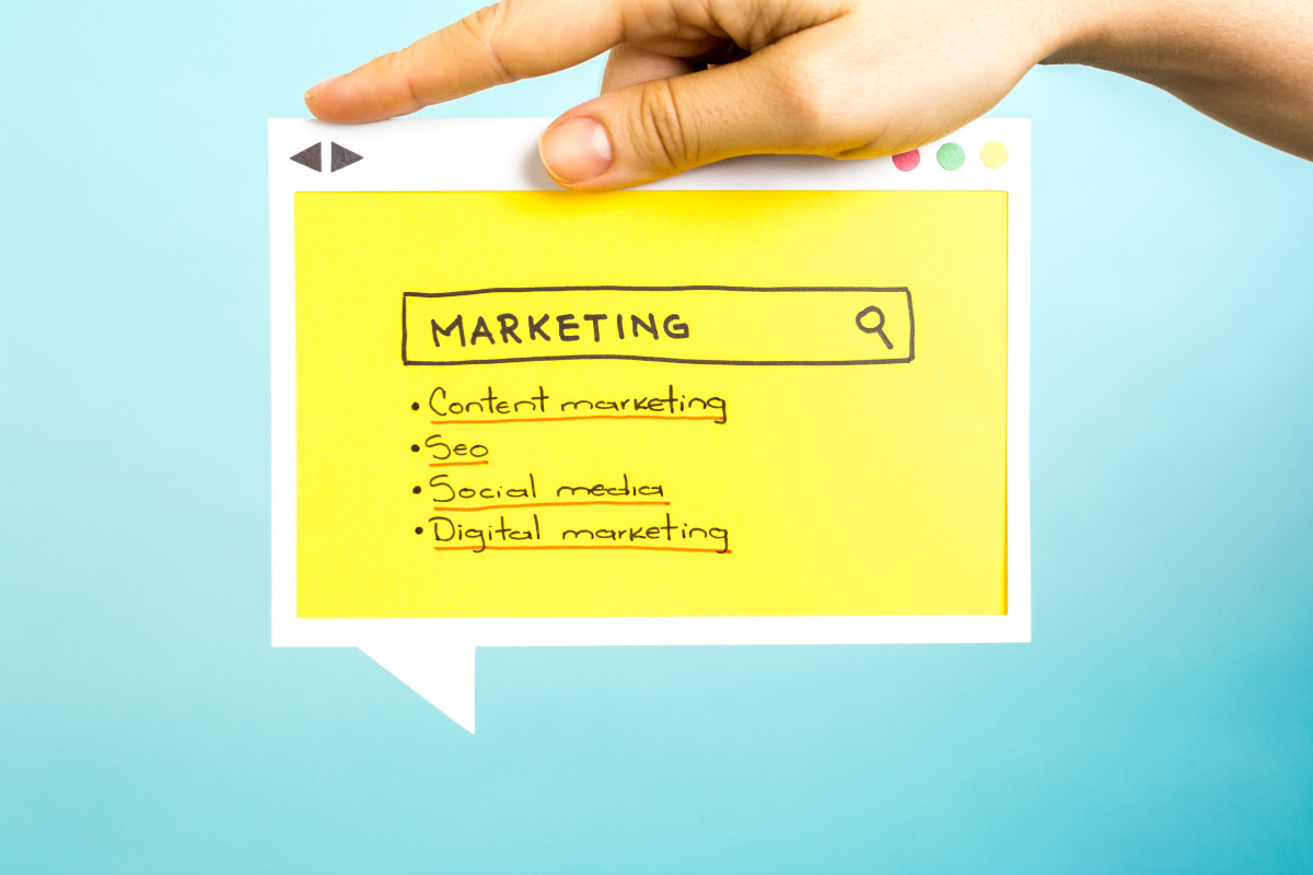 A hand holding a marketing illustration highlighting the importance of content marketing and SEO.