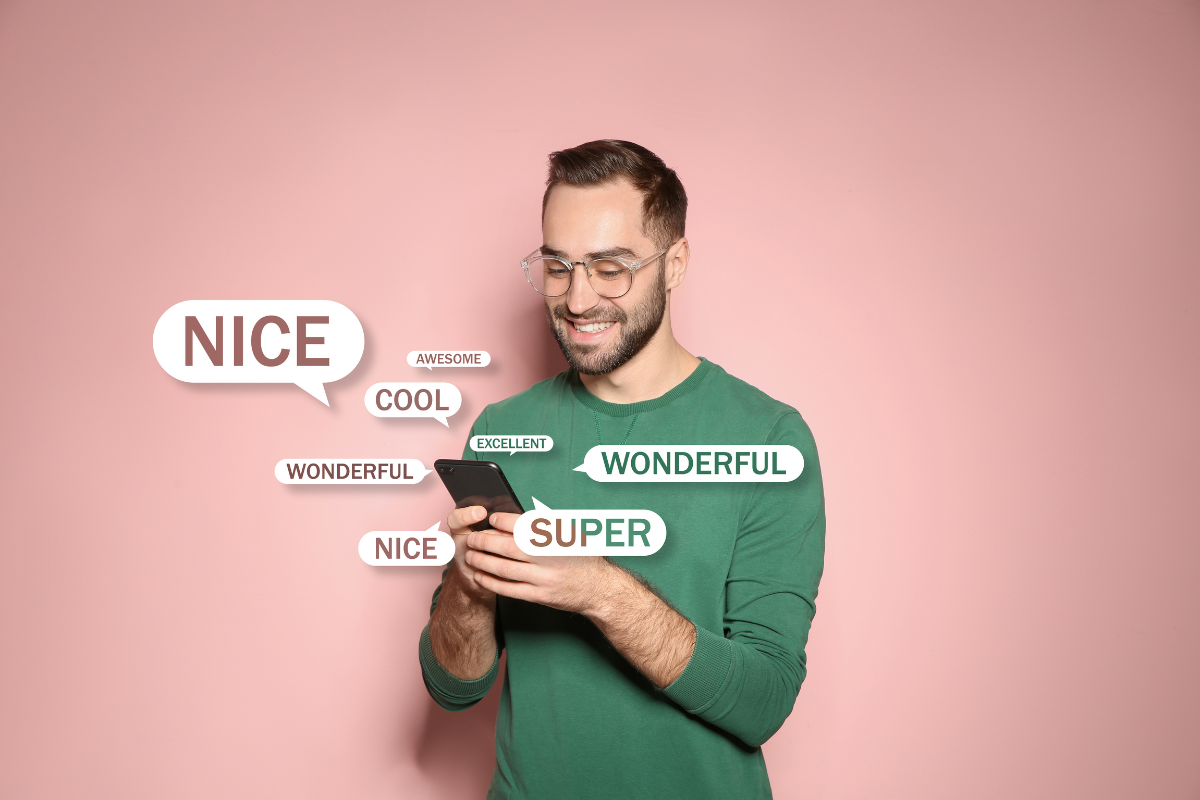 A smiling man reading positive feedback messages like