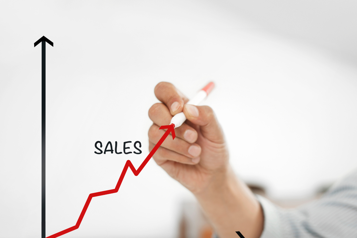 A man drawing an upward sales graph representing how Visio SEO’s expert HVAC SEO solutions can elevate your HVAC business growth and visibility.