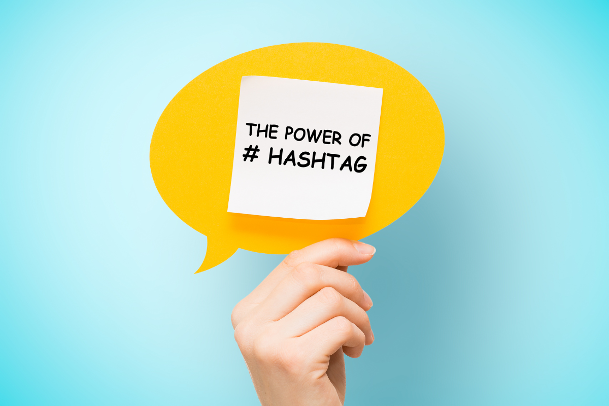 A hand holds a speech bubble with