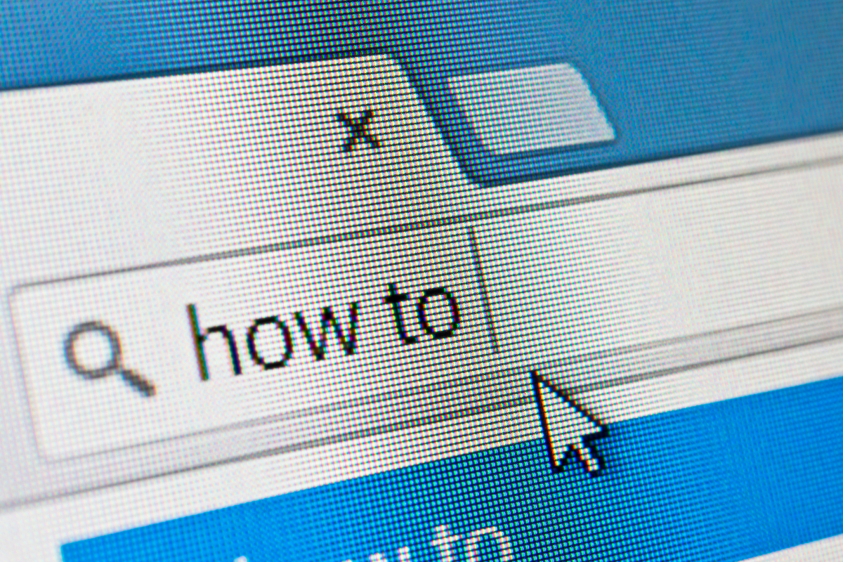 A close-up of a computer screen displaying the words 'How To,' symbolizing guidance and actionable steps for building an effective online presence.