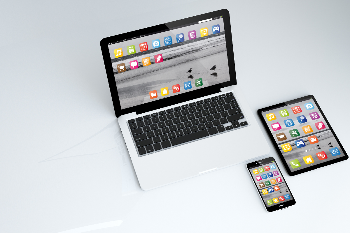 A laptop, tablet, and phone displayed together, emphasizing the importance of mobile optimization to enhance online presence across all devices.