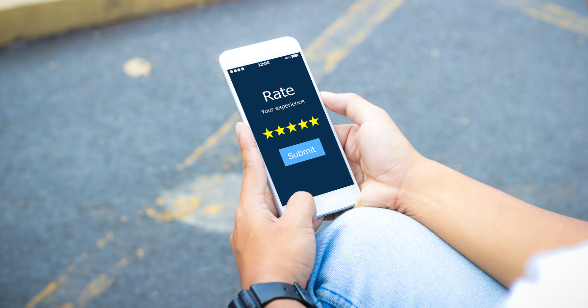 A person rating a service on a smartphone, highlighting the importance of reviews in local healthcare SEO​.