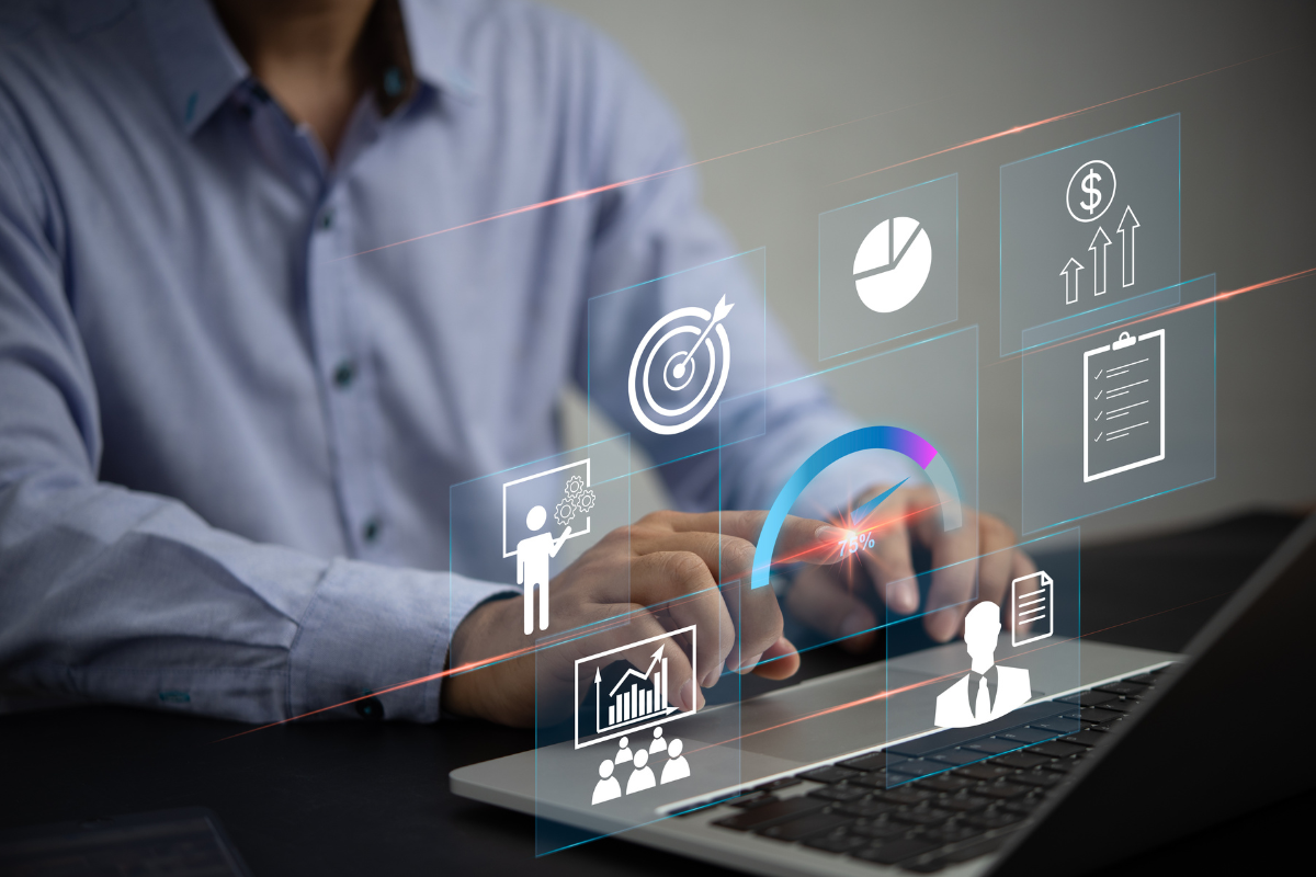 A man typing on a keyboard with a visible diagram, symbolizing the importance of tracking key metrics in web development management to measure success and optimize performance effectively.