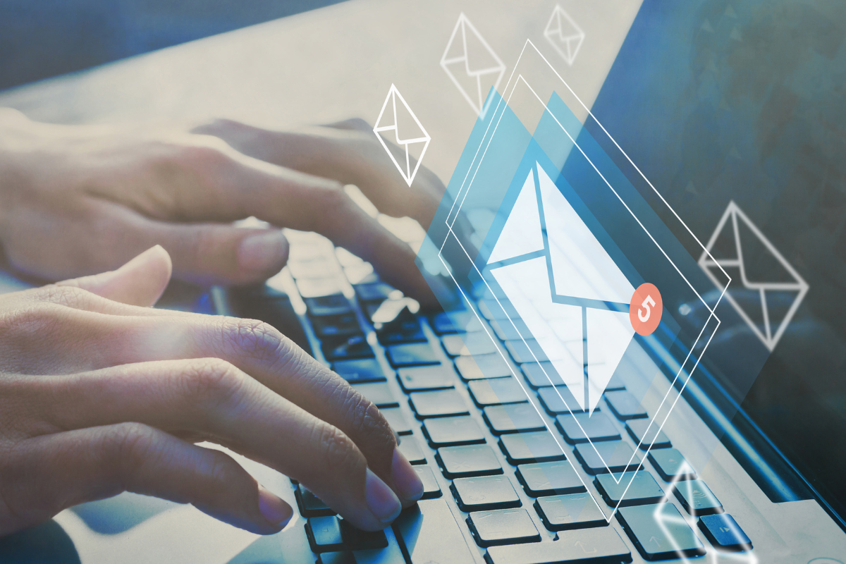 Hands typing on a keyboard with email icons overlayed, suggesting new leads through digital communication.