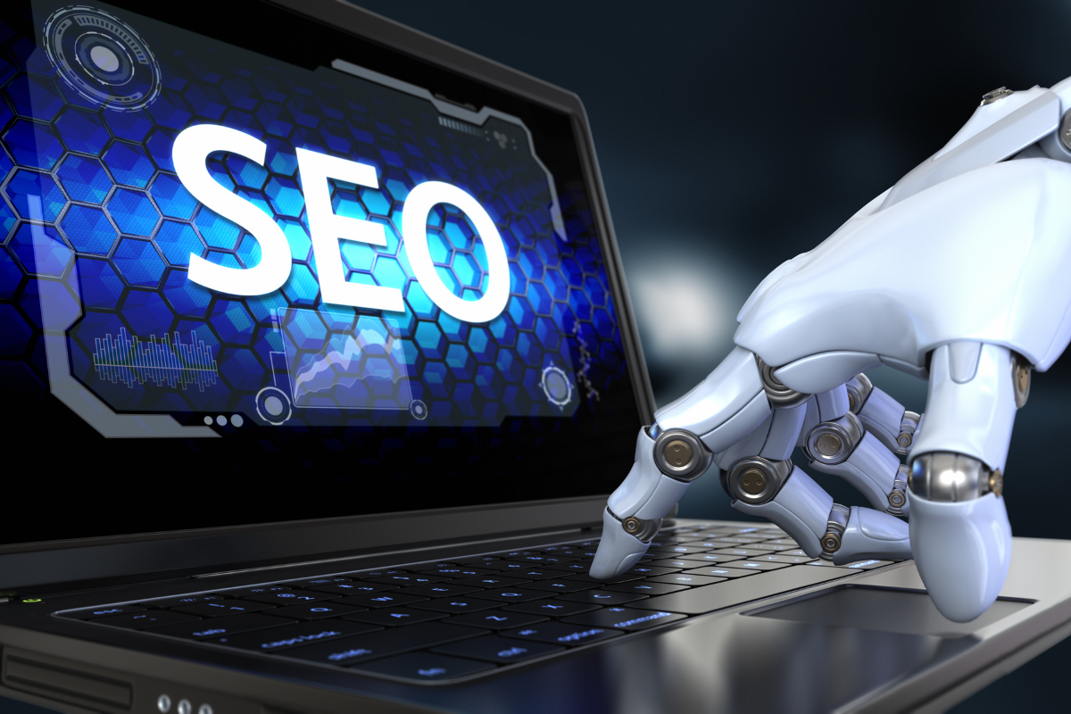 A robotic hand typing on a laptop with the word 'SEO' on the screen, symbolizing the evolution of content marketing and SEO.