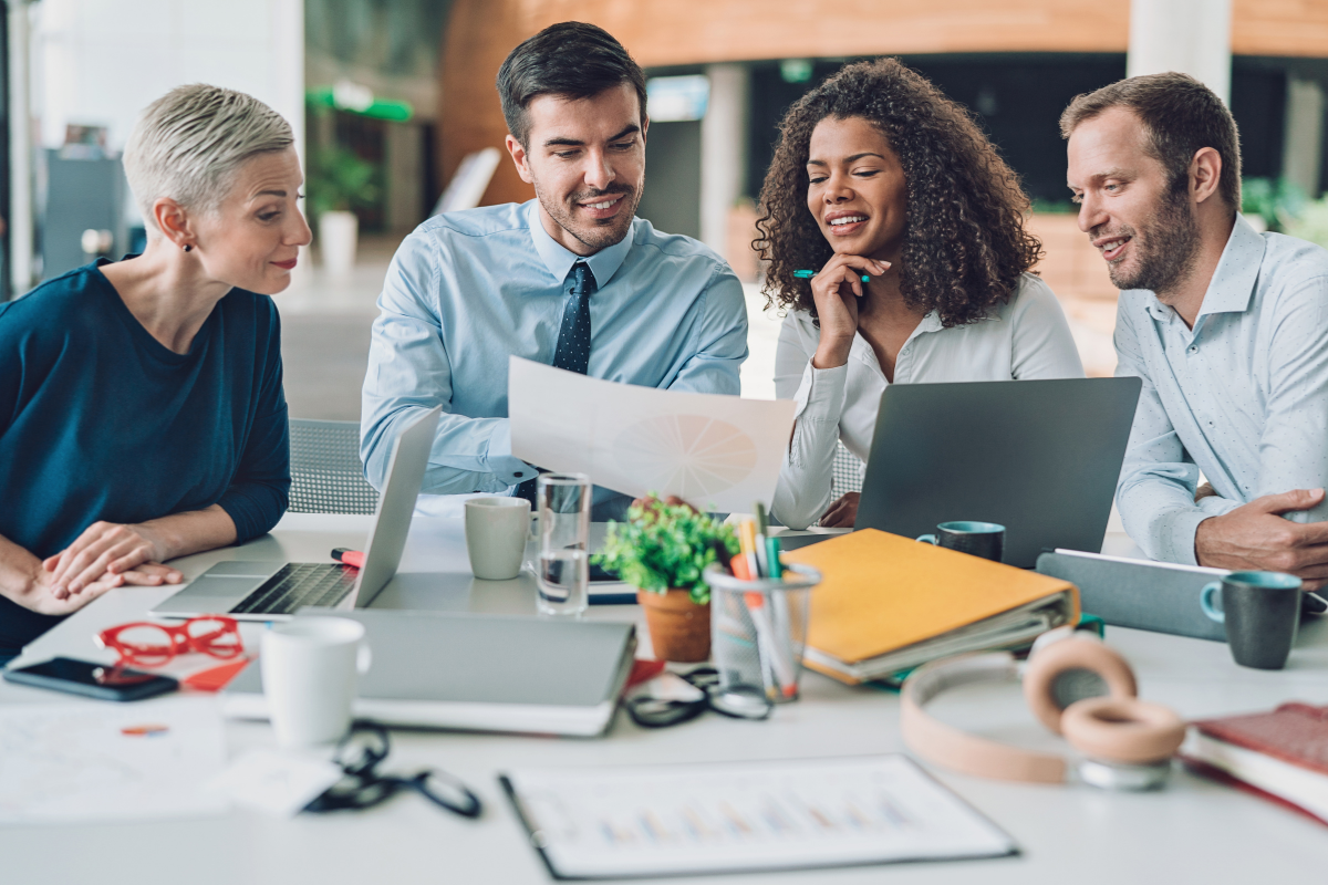 A group of professionals engaged in a lively discussion, emphasizing the critical role of having top-tier email marketers to drive successful campaigns and foster strong customer engagement, sharing insights and strategies for impactful email marketing.