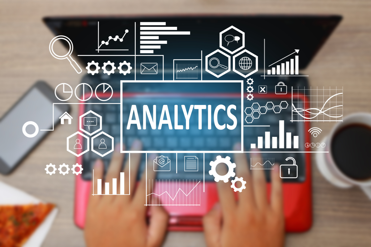 A man typing on a keyboard with an analytics diagram displayed, highlighting the critical role of data analytics in web development management for achieving measurable success.