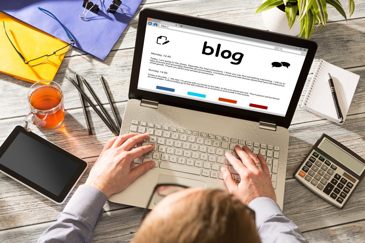 A person typing on a laptop, representing the importance of personalized strategies in content marketing and SEO to boost user engagement and improve search engine rankings.