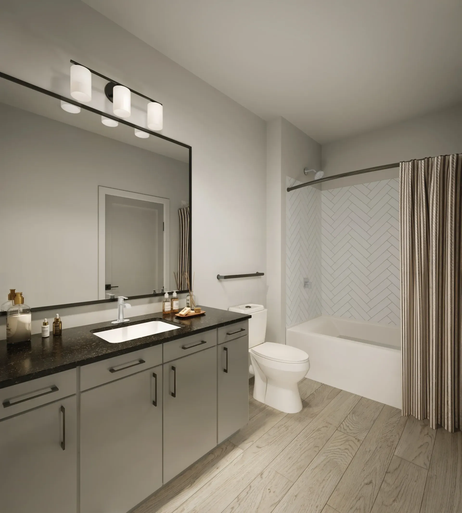 Modern bathroom with gray vanity, large mirror, toilet, tub, and striped shower curtain