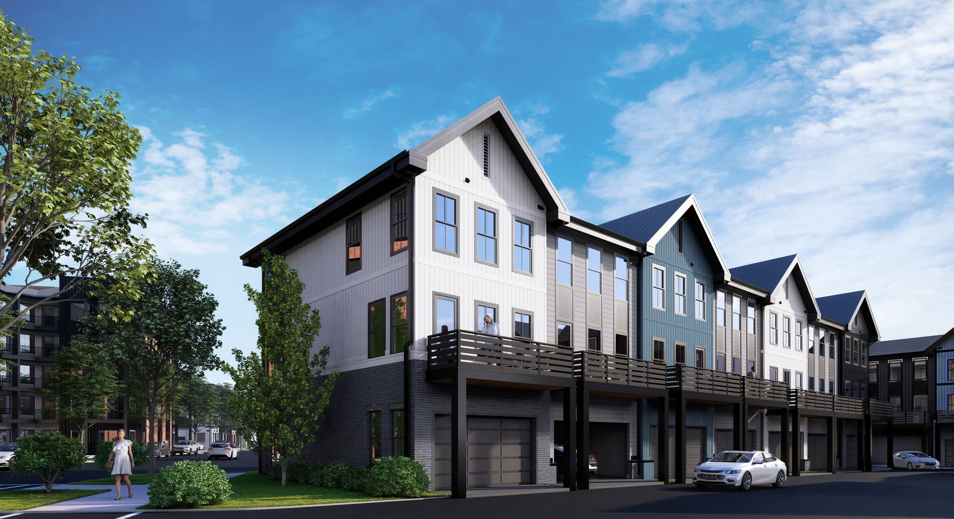 Modern row of gray-and-white townhouses with peaked roofs on a sunny street
