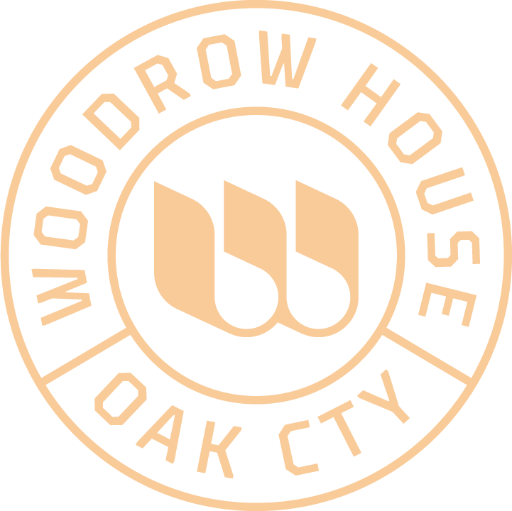 Woodrow House Oak City circular logo in pale peach with stylized “wh” monogram center