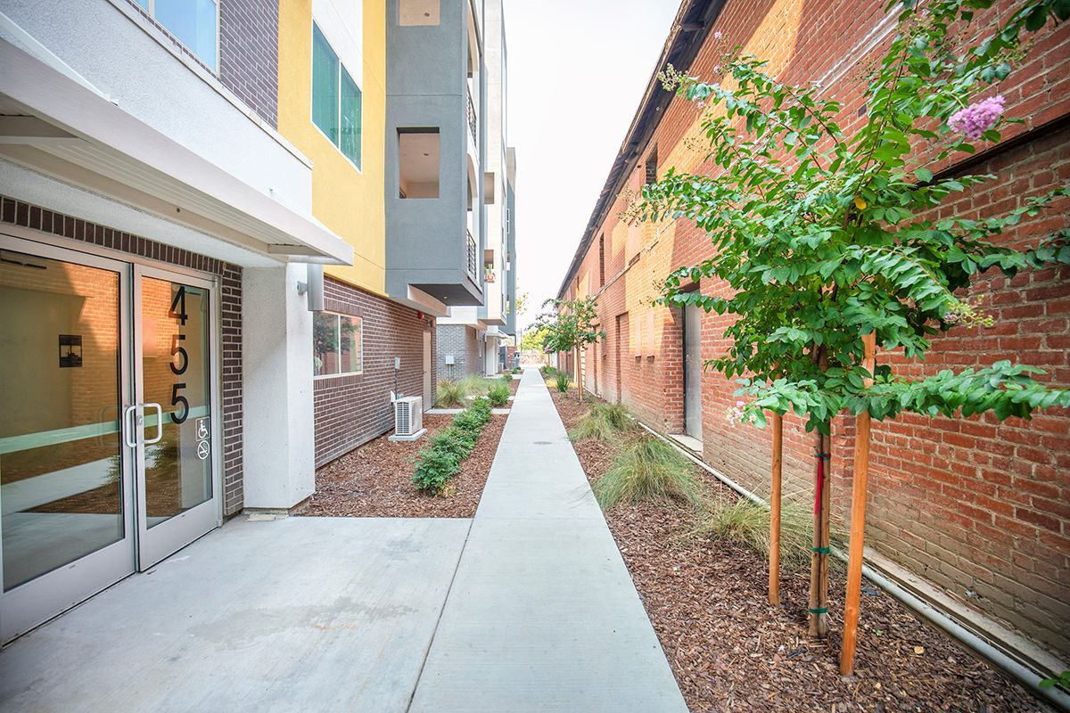 photo showing building entrance and exterior walkway