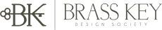 Brass Key Design Society logo with stylized BK monogram and text in gray and gold on white background