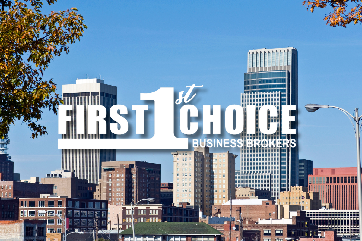 A city skyline with the first choice business brokers logo in the foreground