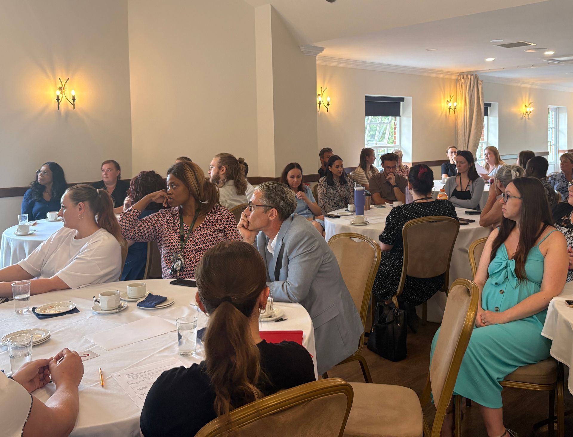 colleagues from across the business, listening to presentation