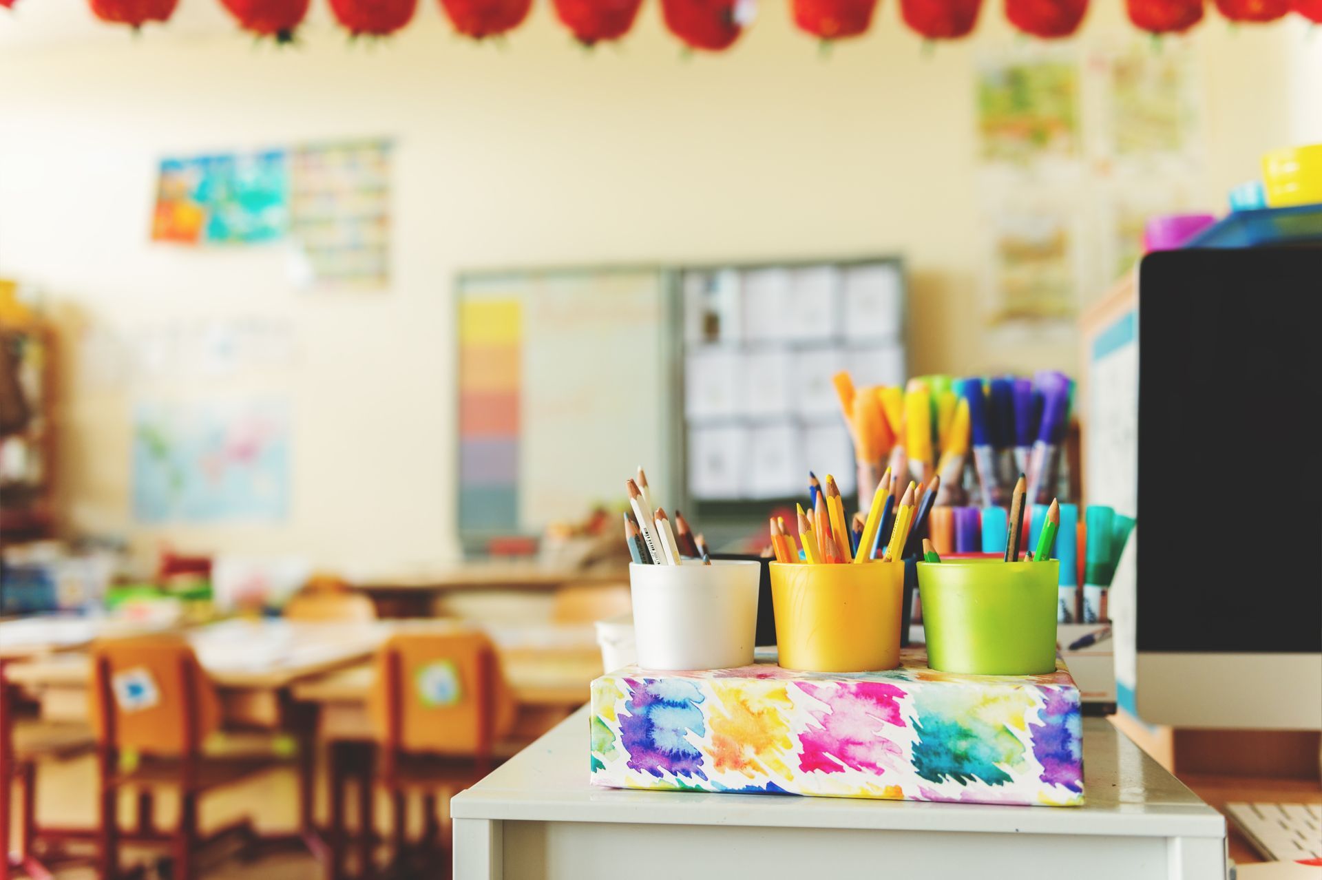 A classroom filled with lots of supplies and a computer.