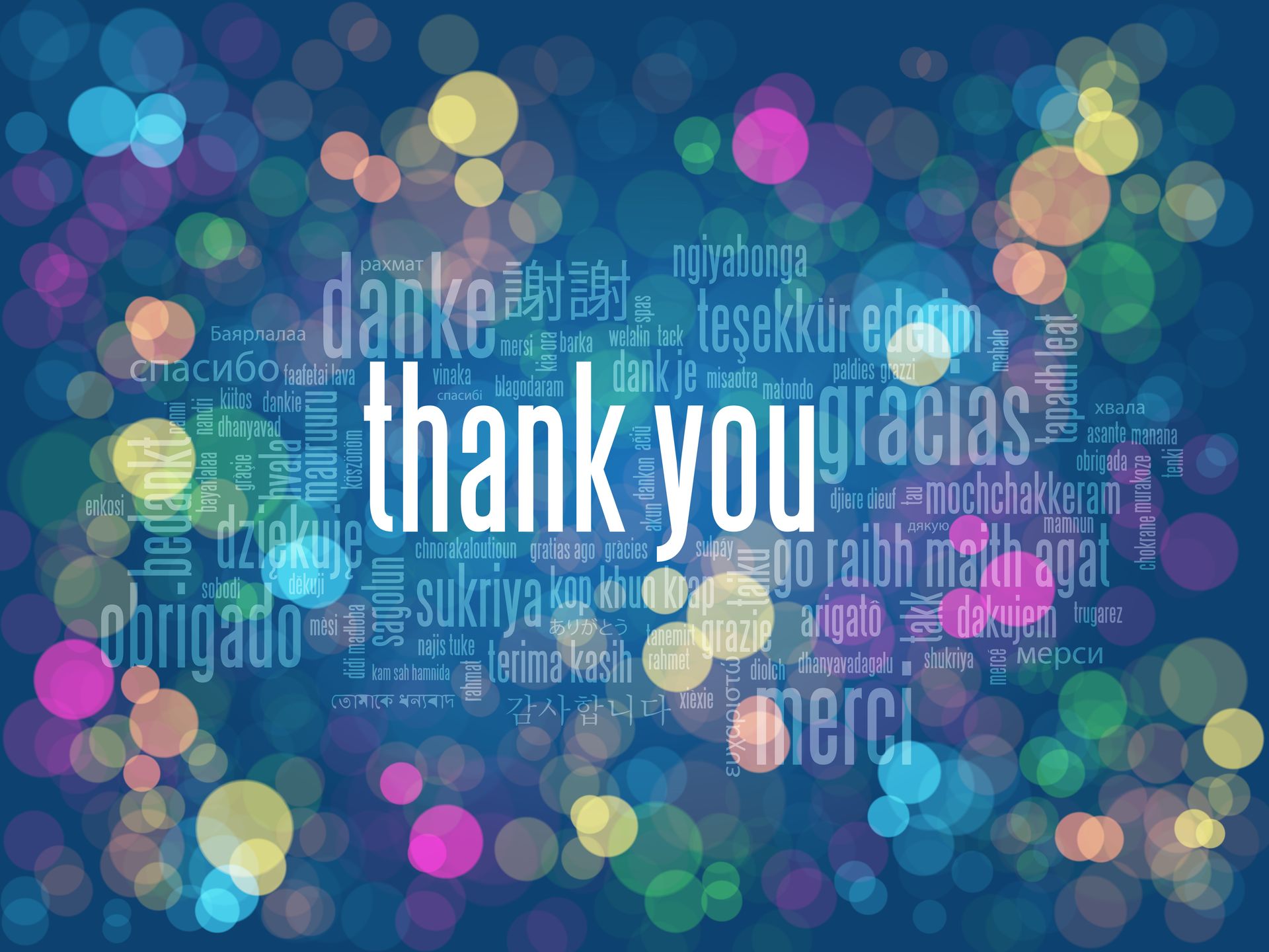 The word thank you is surrounded by colorful bubbles on a blue background.