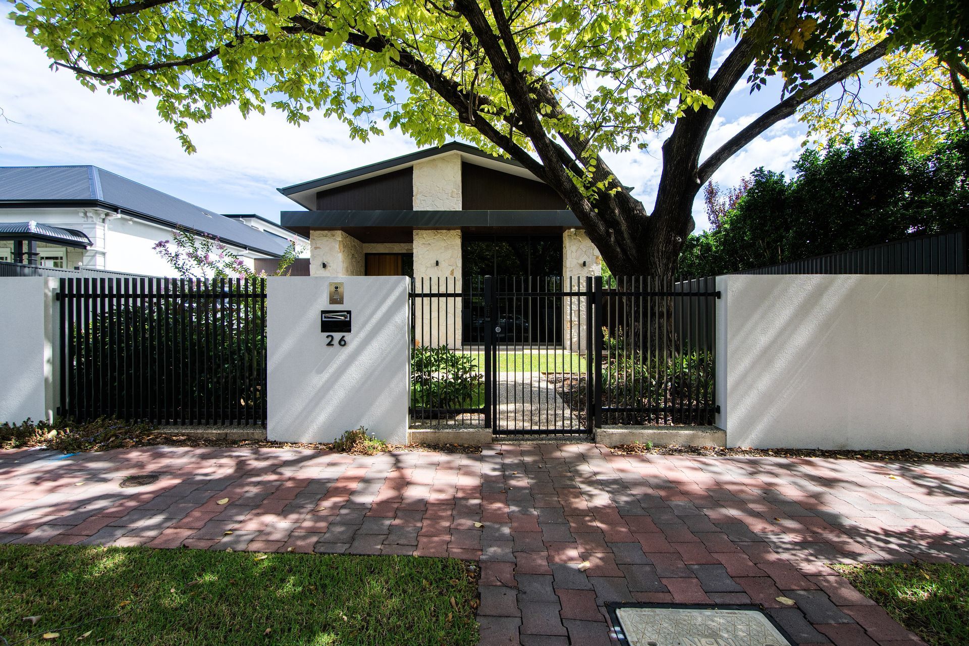F4 Vertical Blade fencing in monument color, 65mm spacing between each blade Suburb: Hawthorn Material: Steel Type: F4 Modern Slat